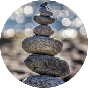 Image of rocks balancing on each other in a pile.